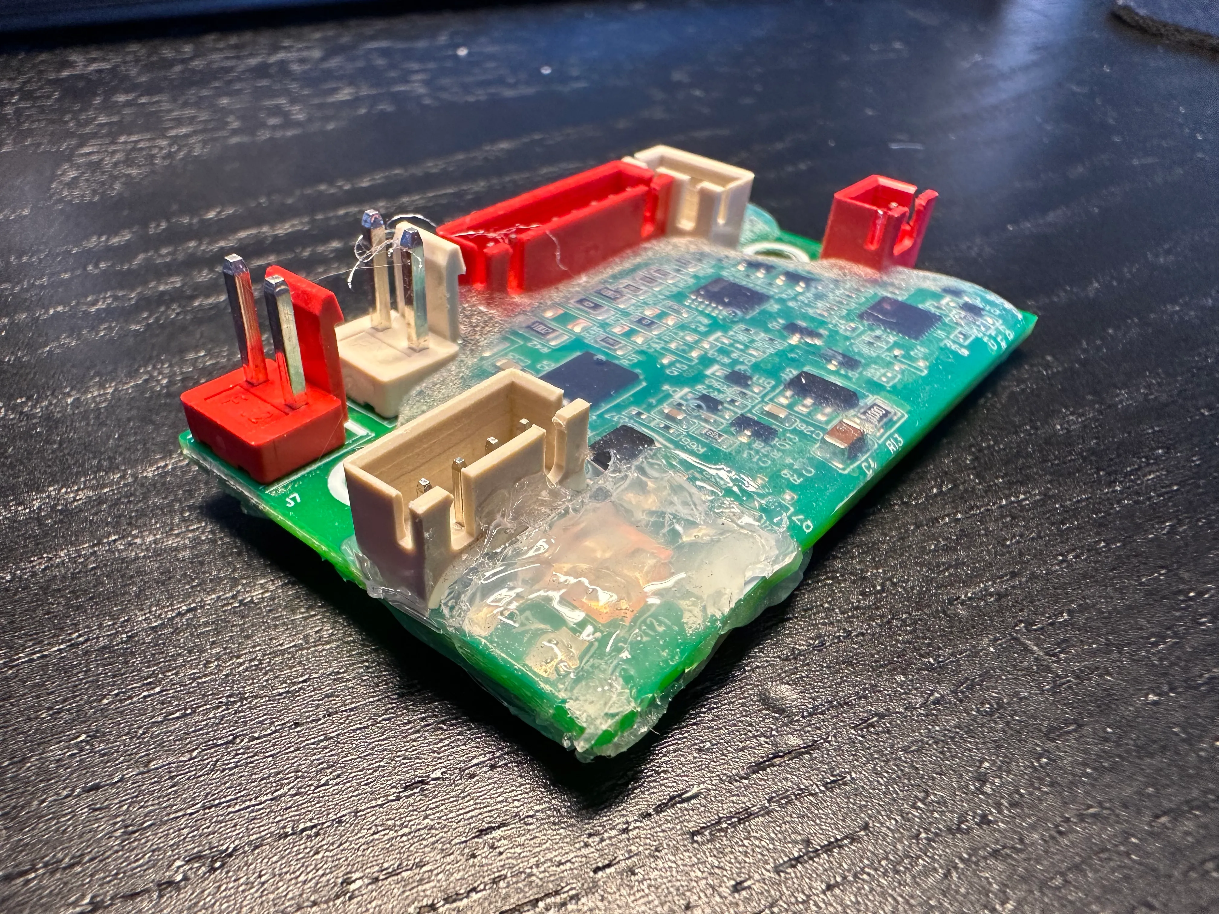 The top coating, covering the soldered transistors