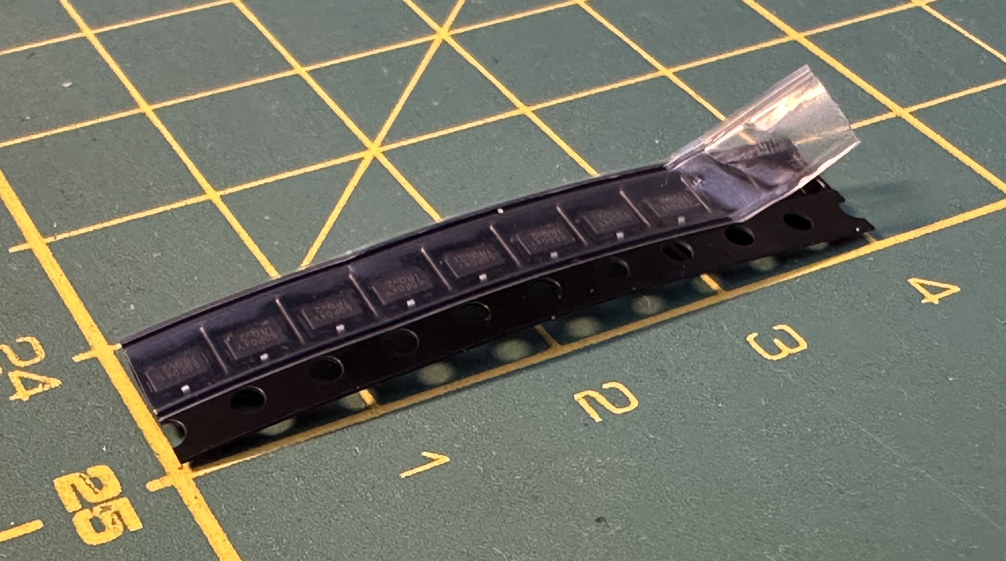 The MOSFETs. If you don&rsquo;t know how small SOT-23 is, look at the centimeter lines below.